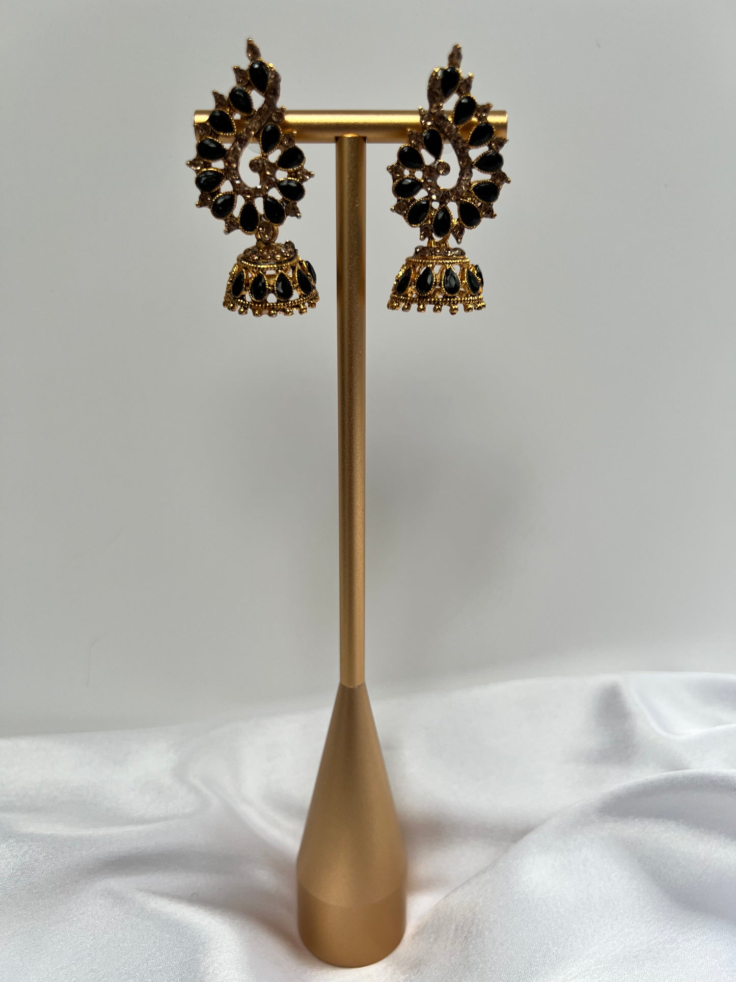 Golden stoned jhumka earrings with tear drop shaped grey stones E3050