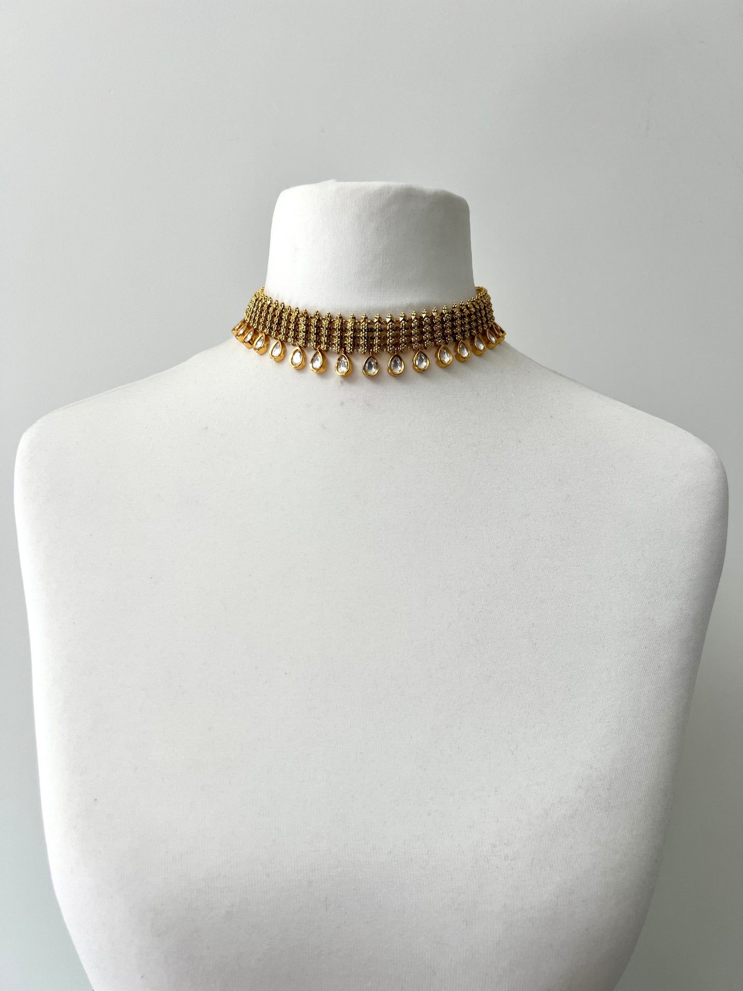 SANTHIYA- golden tear drop Kundan stoned necklace with matching small flat earrings N3300