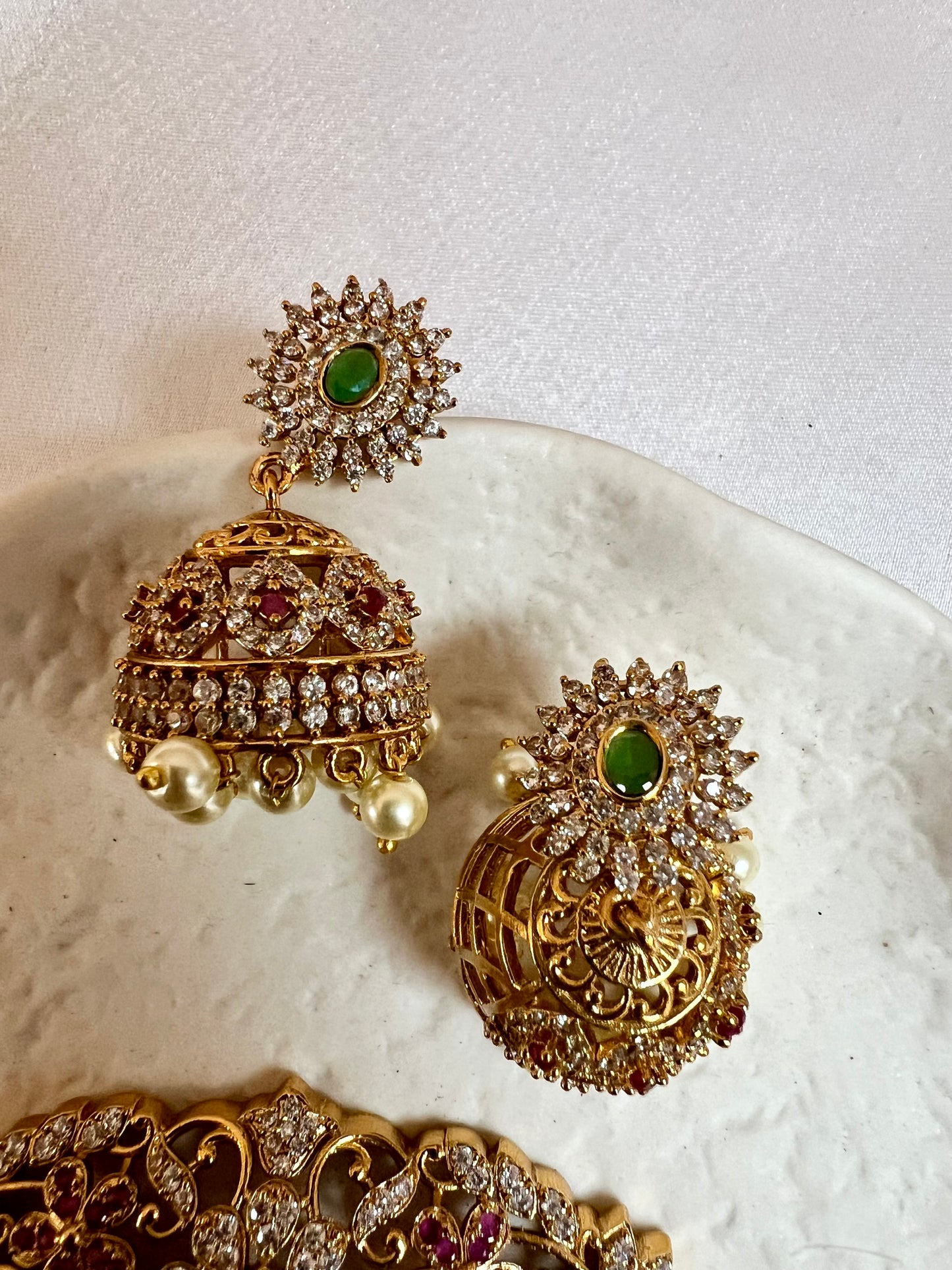 BANU- Golden oval shaped choker in ruby, green and white stones with small jhumkas N3183