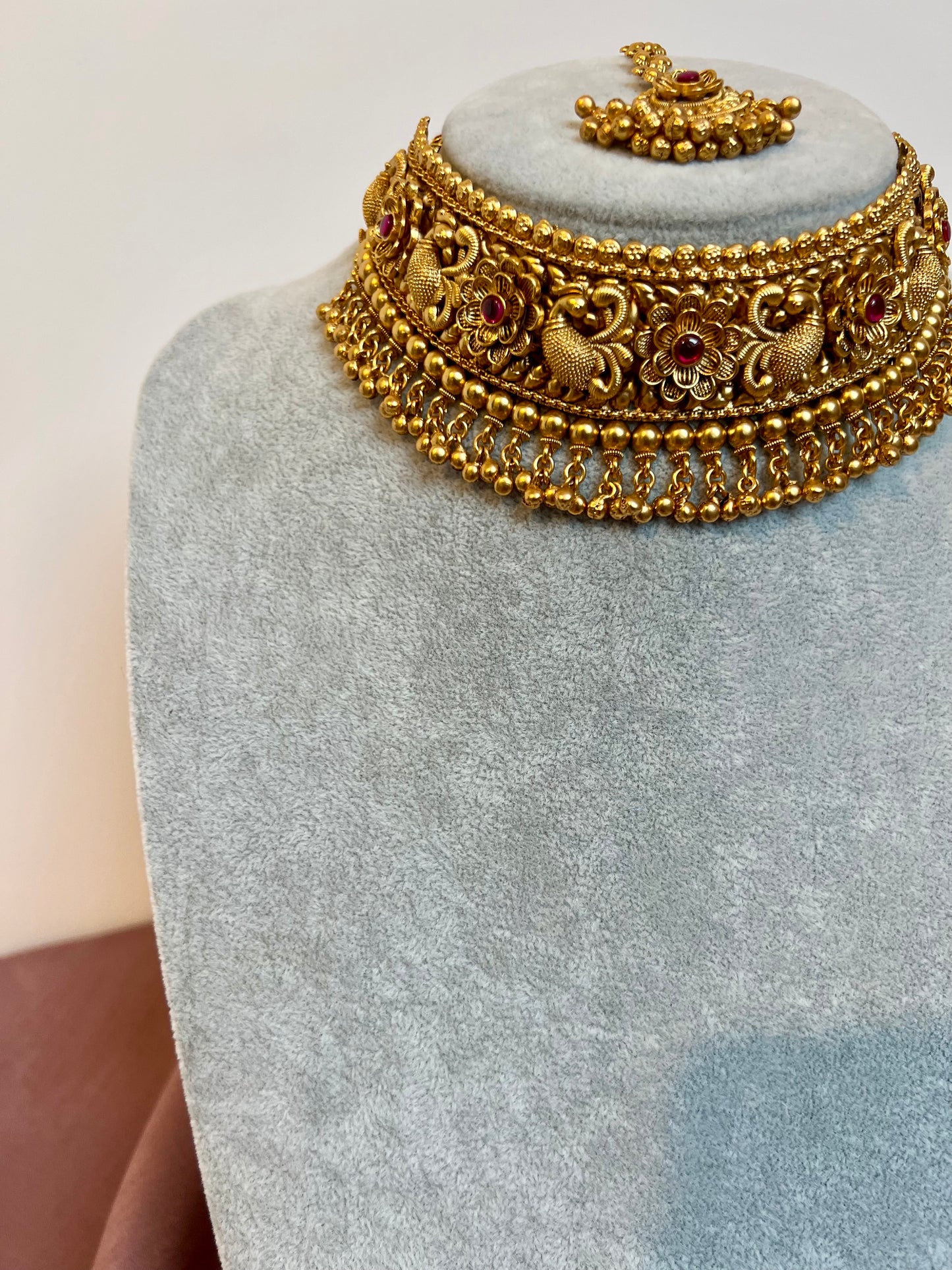 VINO- Antique high neck golden necklace with golden pearls and ruby stones, tikka and jhumkas N3181