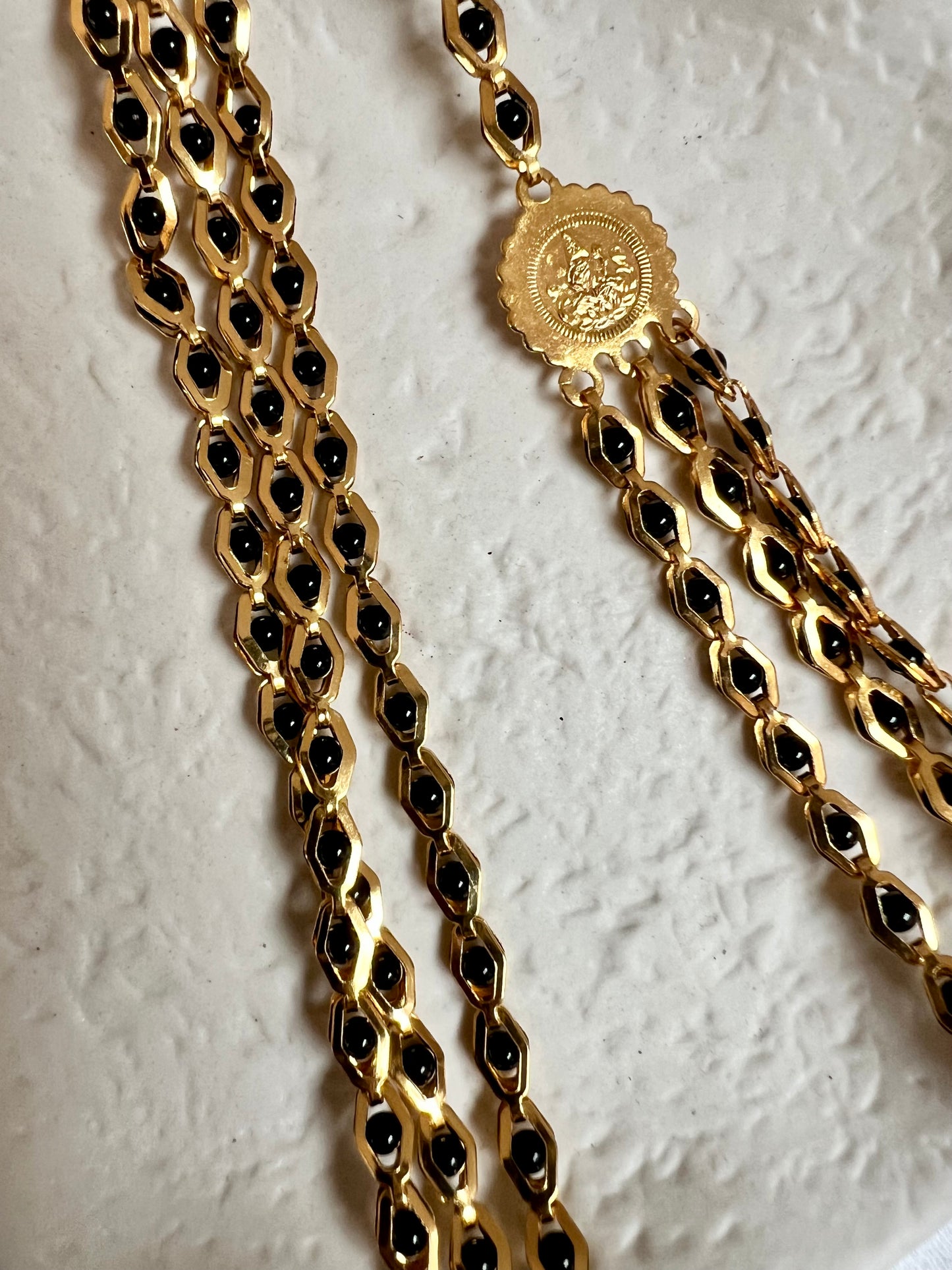 SHAMINI - long golden chain with black balls all along N3220