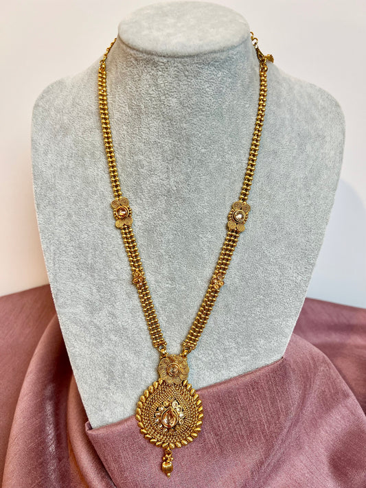 THARSHINI - long tear drop shaped pendant golden necklace with round stones N3212