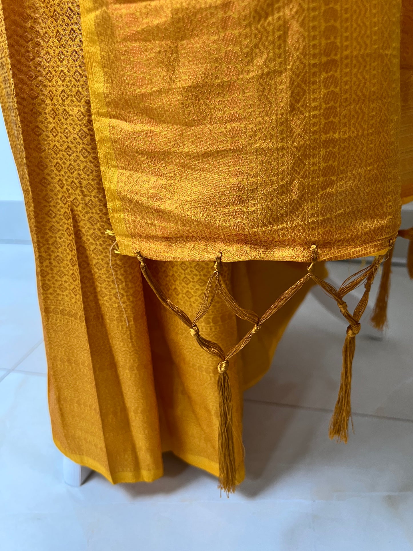 Plain yellow kubera silk saree, comes with tassels and blouse piece attached S3011