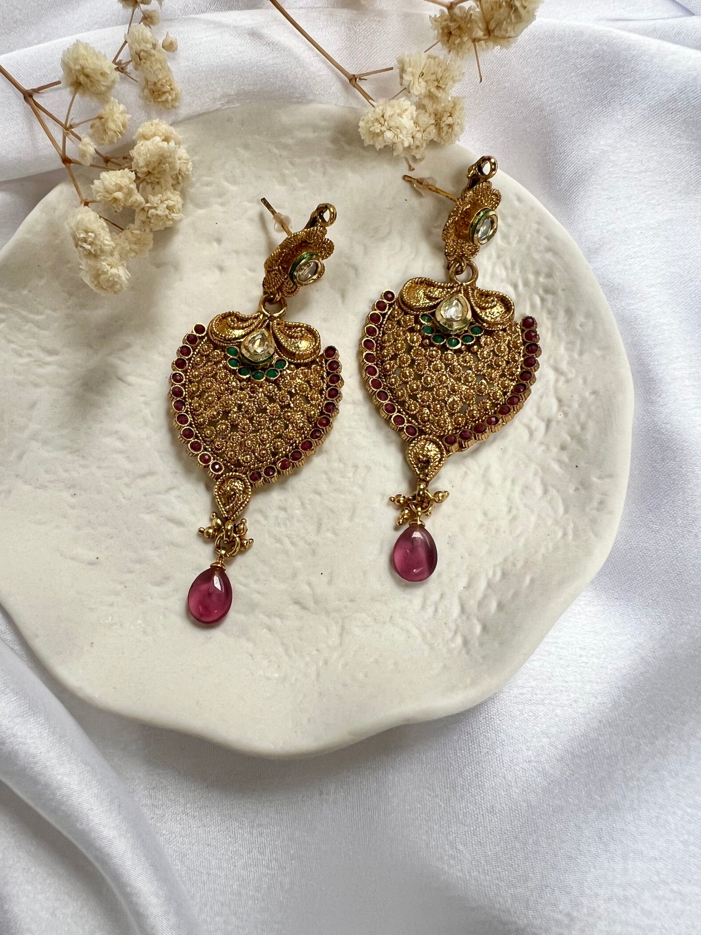 Long flat golden earrings with purple and green stones E3065