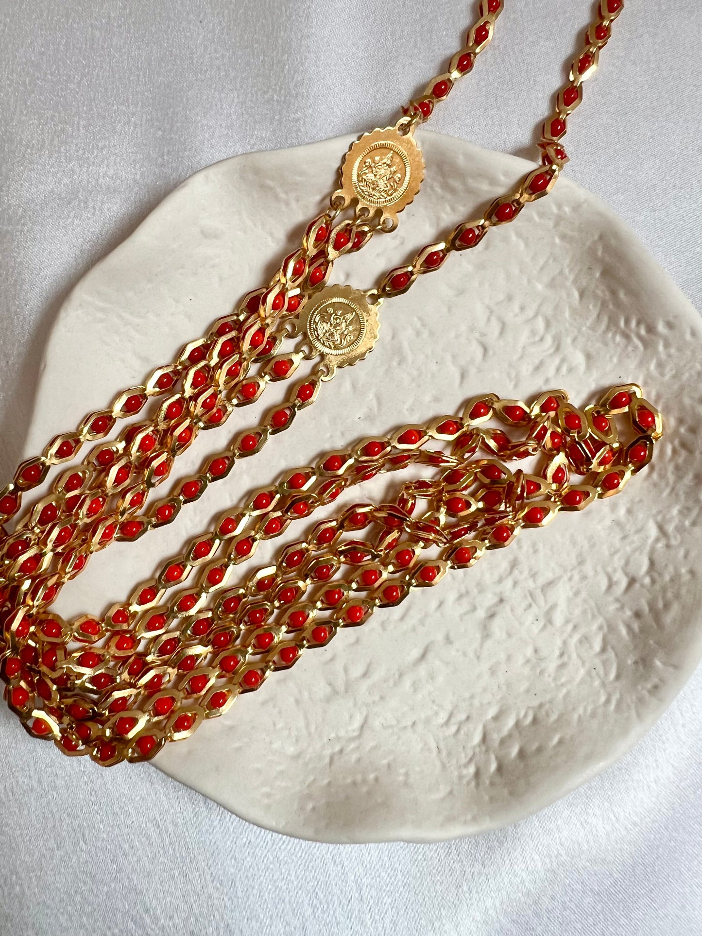 HASINI - Long golden chain with red balls all along N3217