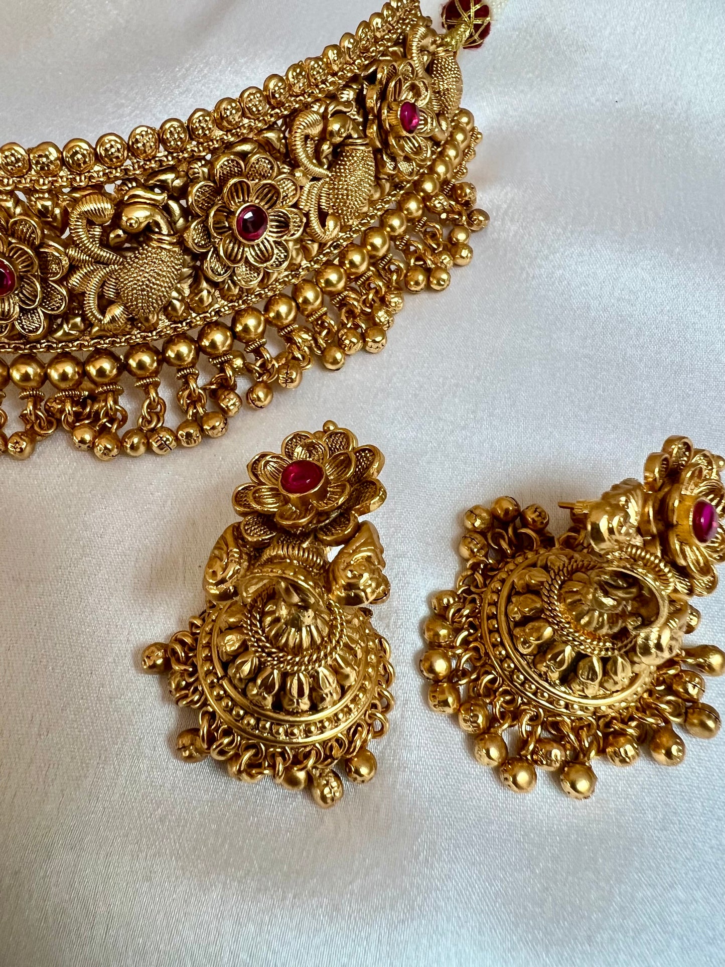 VINO- Antique high neck golden necklace with golden pearls and ruby stones, tikka and jhumkas N3181