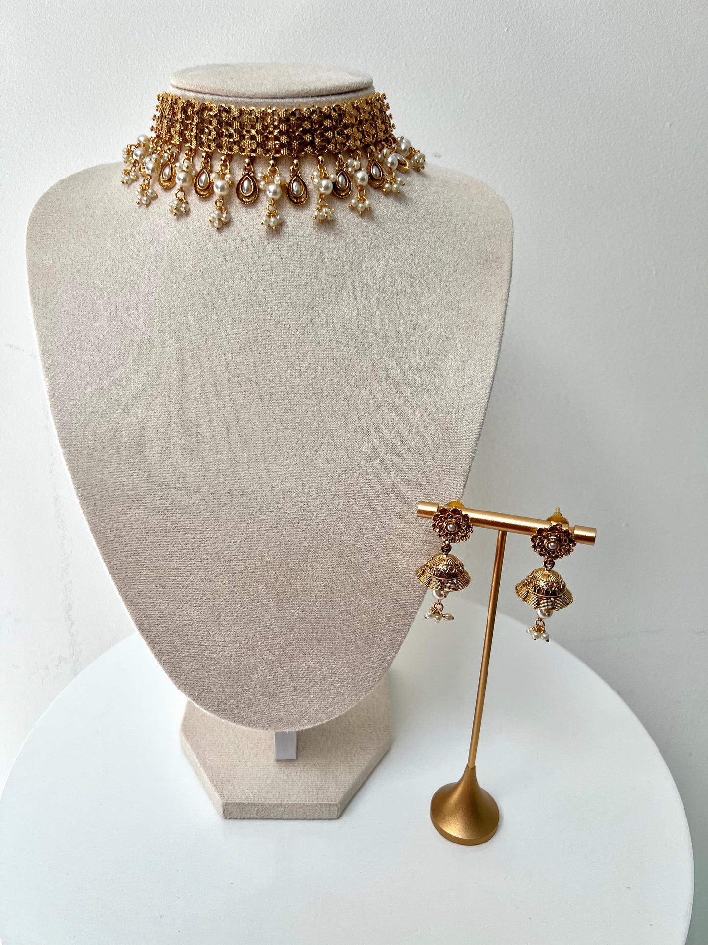 MALANI- Golden high neck band necklace embellished with dangling pearls, comes with matching small jhumkas N3296