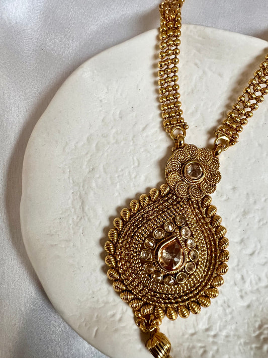 THARSHINI - long tear drop shaped pendant golden necklace with round stones N3212