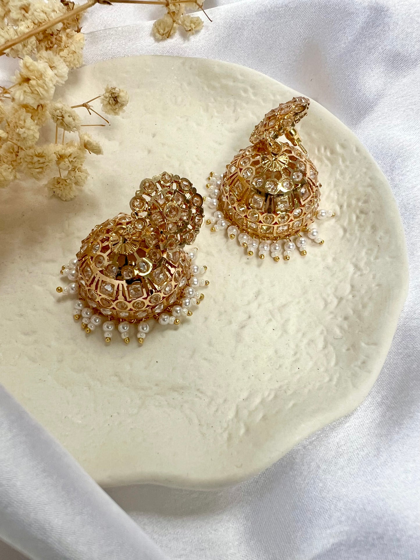 Gold plated white stone pearl jhumka earrings E3023