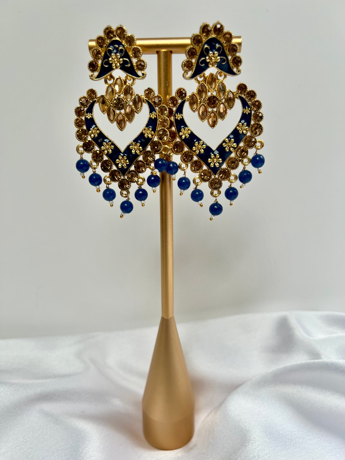 Long flat blue painted earrings with champagne coloured stones E3074