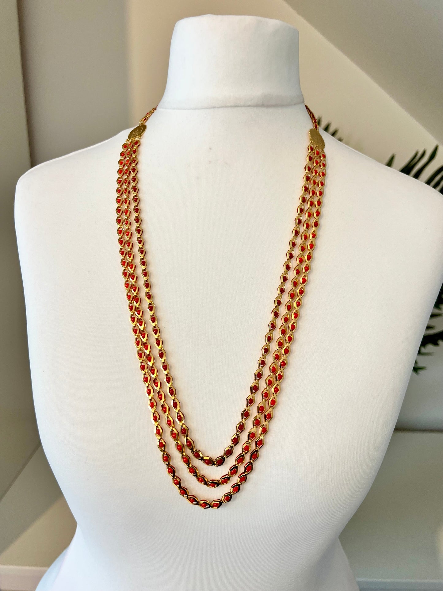 HASINI - Long golden chain with red balls all along N3217