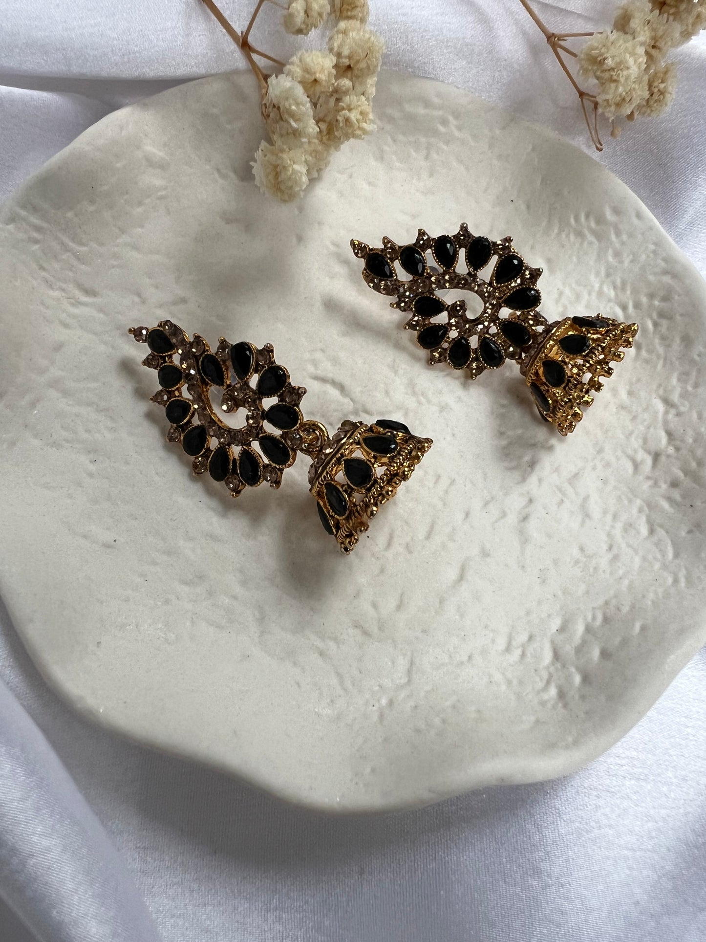 Golden stoned jhumka earrings with tear drop shaped grey stones E3050