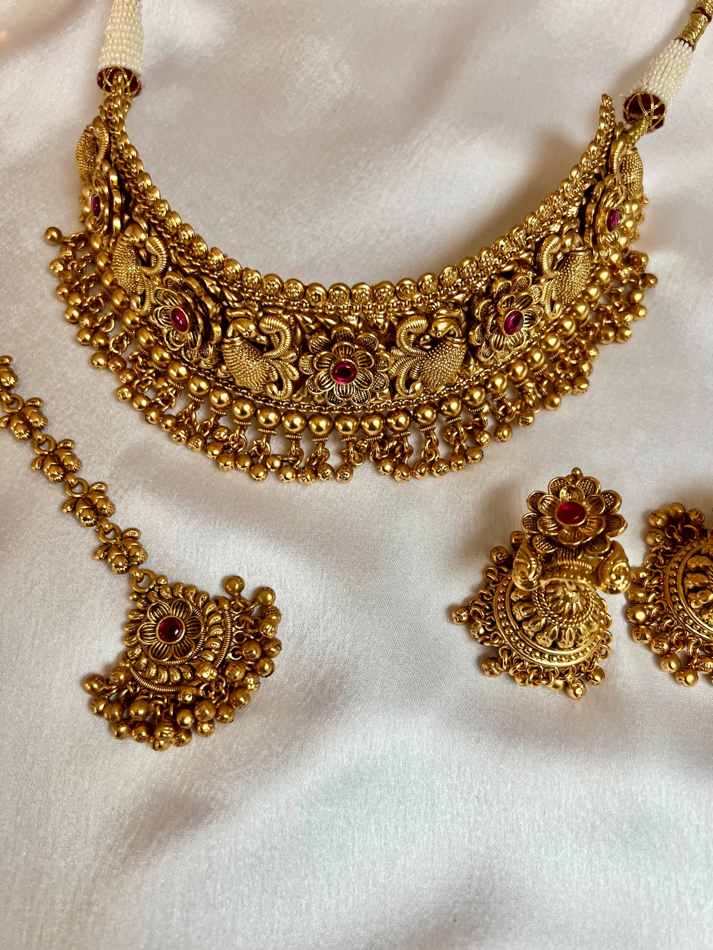 VINO- Antique high neck golden necklace with golden pearls and ruby stones, tikka and jhumkas N3181