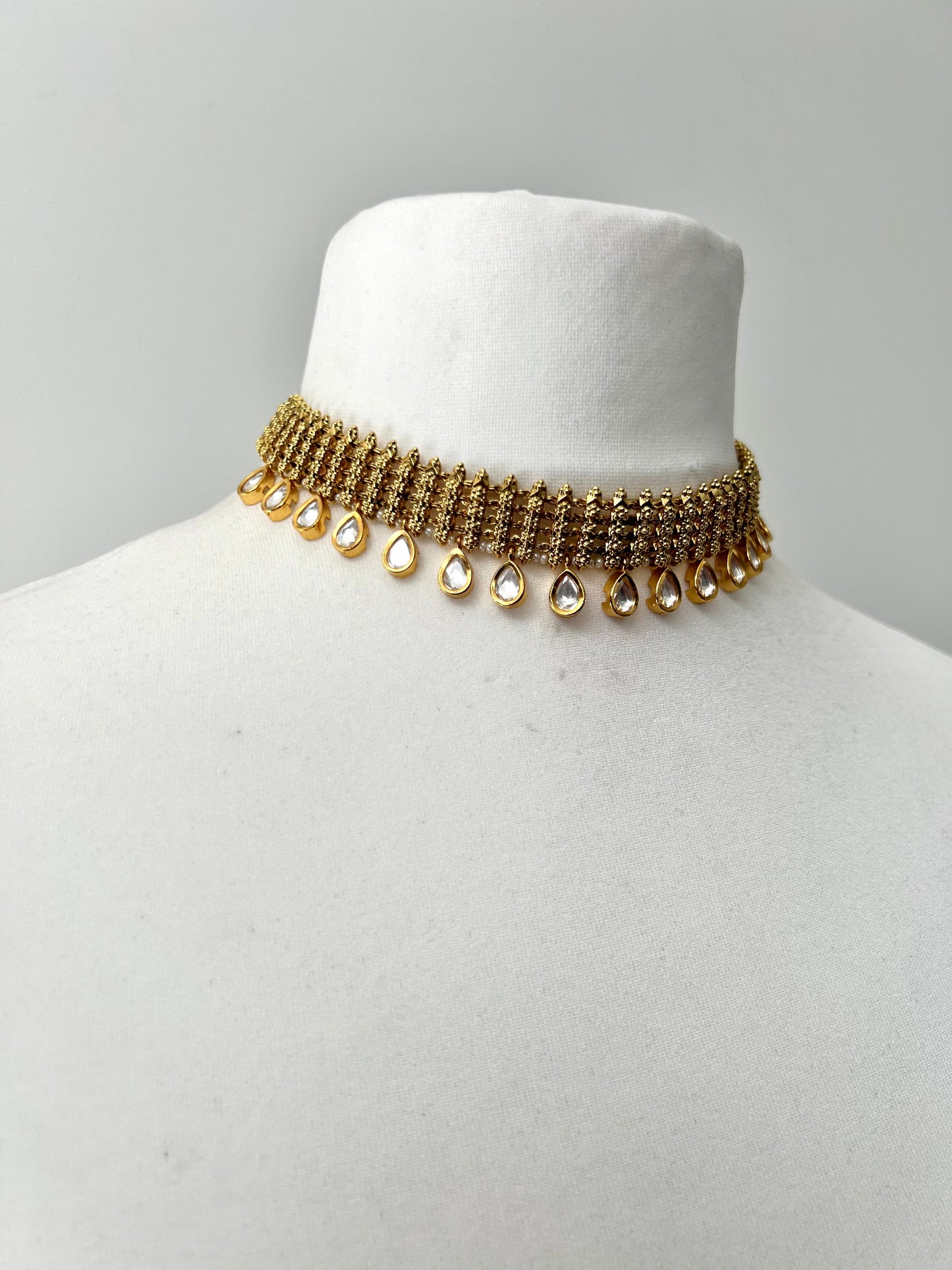 SANTHIYA- golden tear drop Kundan stoned necklace with matching small flat earrings N3300