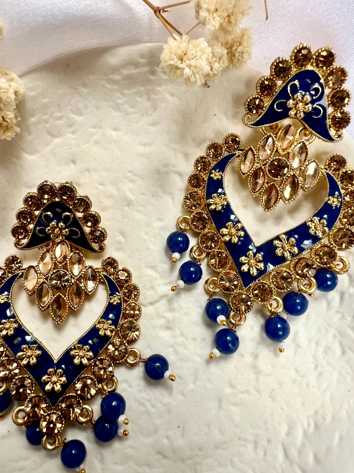 Long flat blue painted earrings with champagne coloured stones E3074