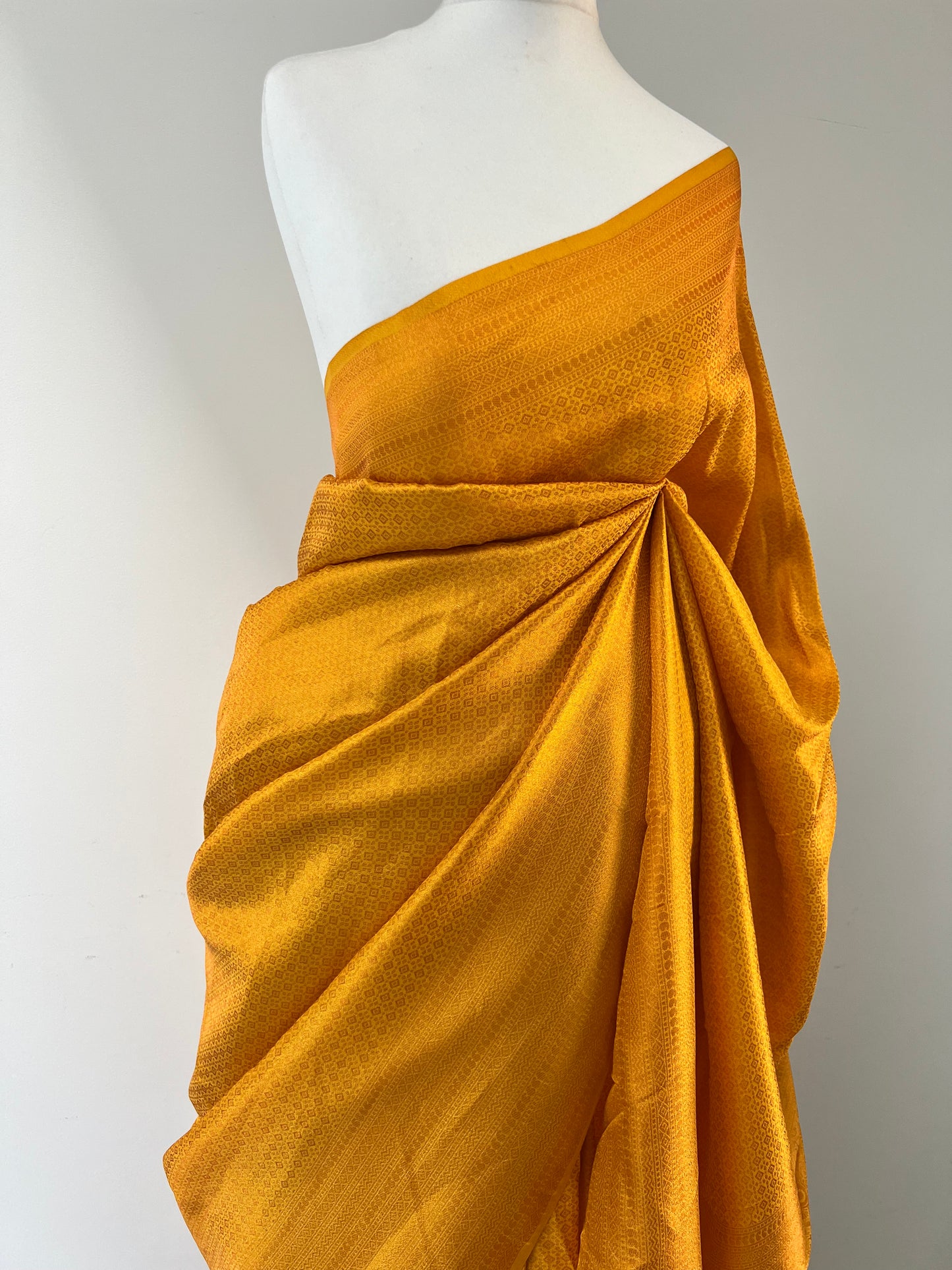 Plain yellow kubera silk saree, comes with tassels and blouse piece attached S3011