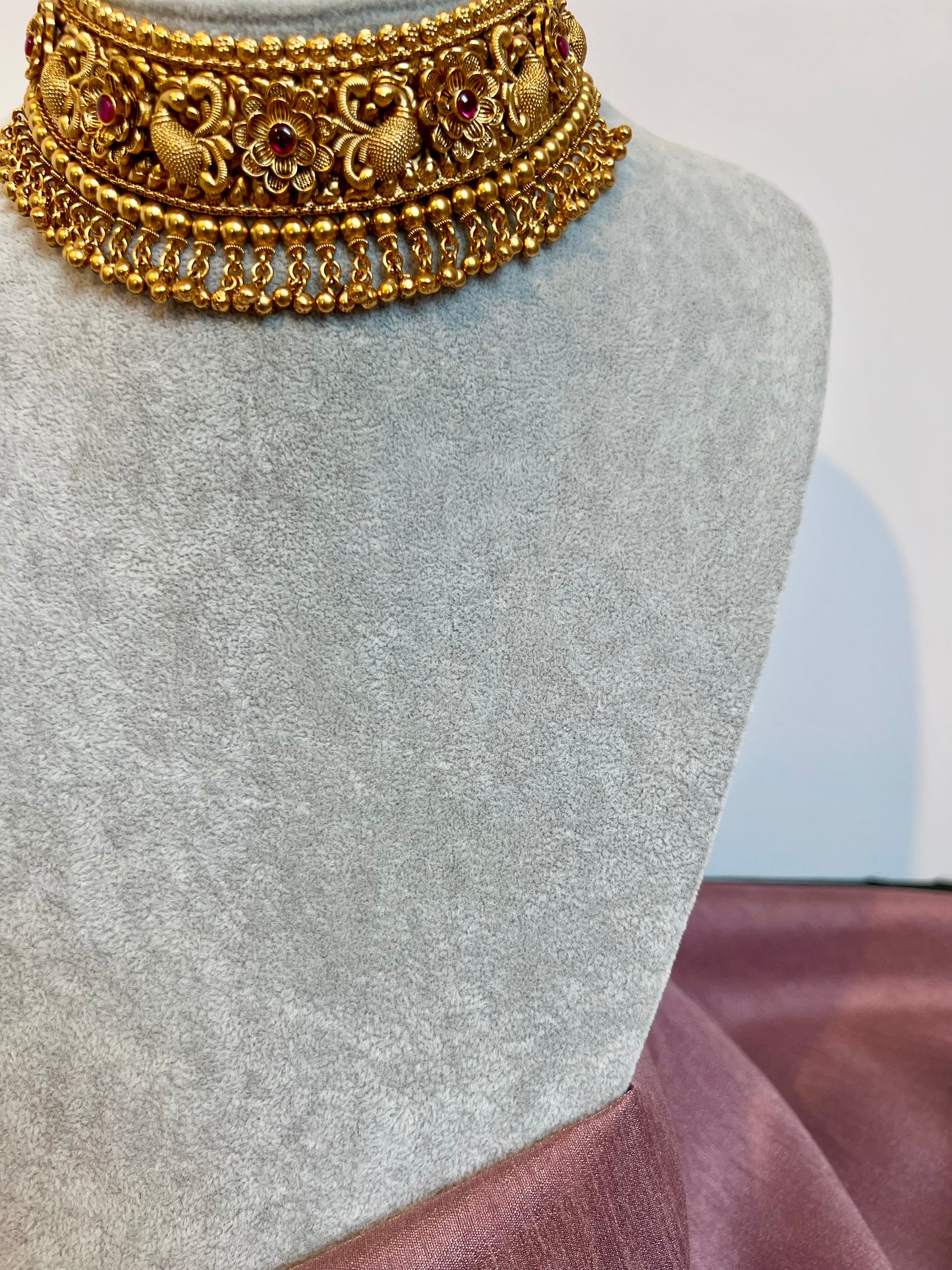 VINO- Antique high neck golden necklace with golden pearls and ruby stones, tikka and jhumkas N3181