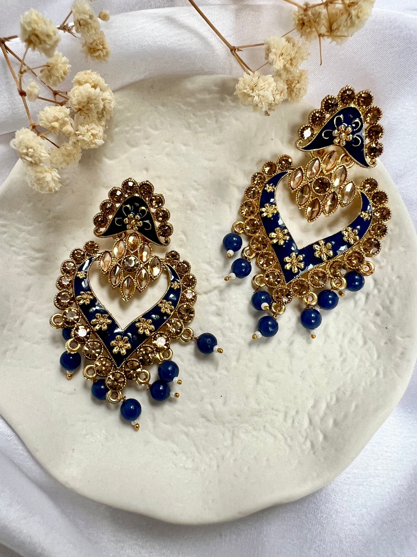 Long flat blue painted earrings with champagne coloured stones E3074