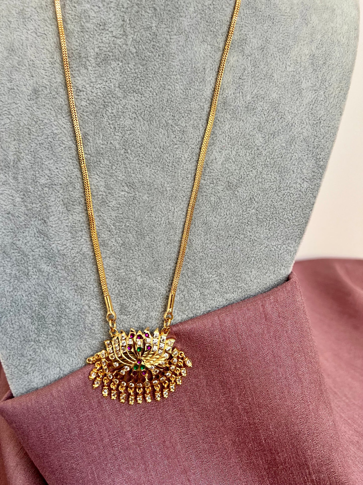 KANIKA - Long Impon small lotus pendant necklace in rubygreen stones N3040