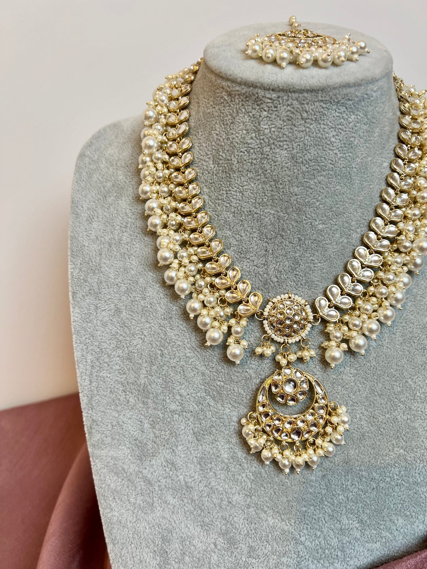 KANITHA- long pearl necklace with matching earrings and tikka N3200