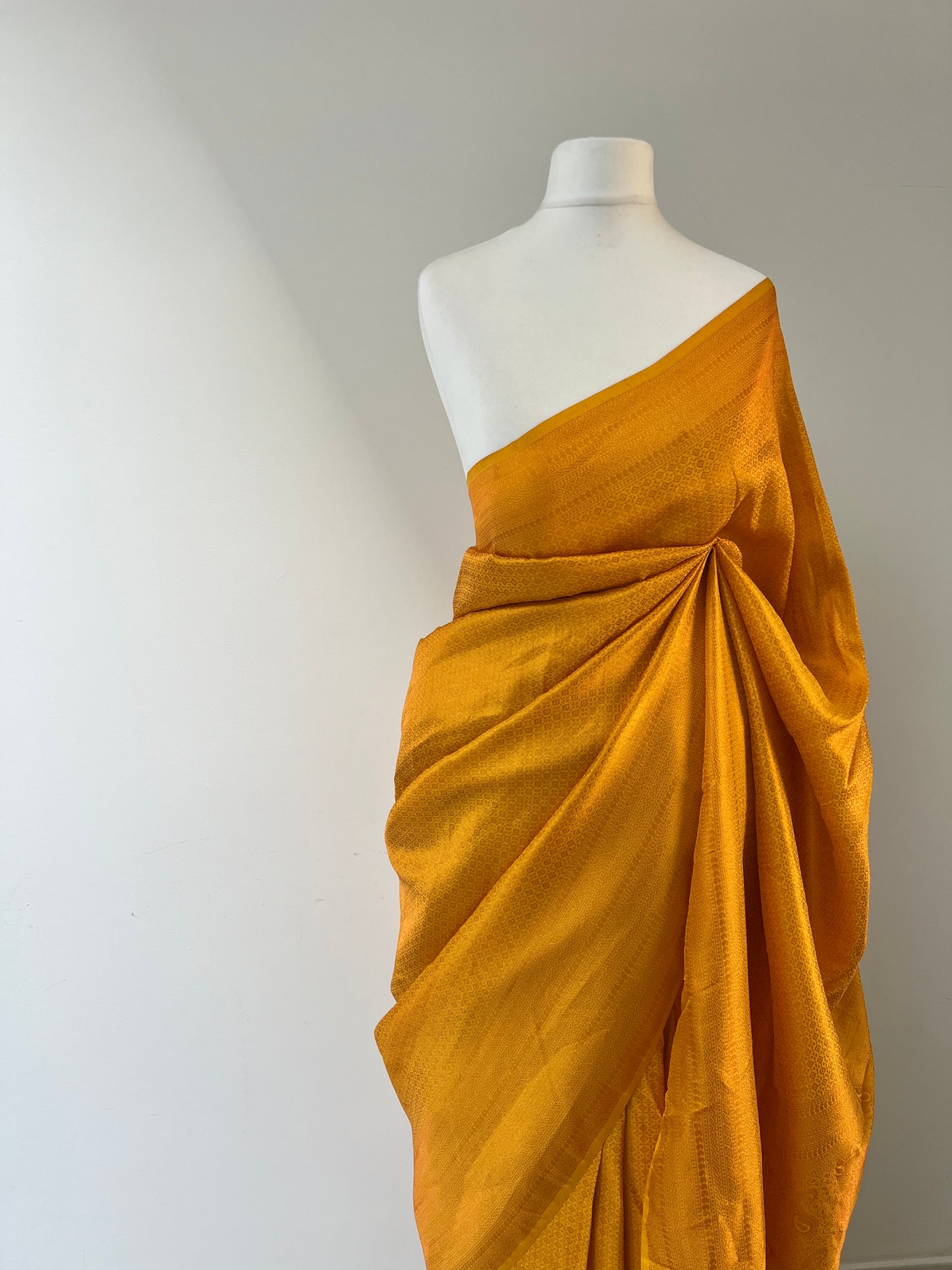 Plain yellow kubera silk saree, comes with tassels and blouse piece attached S3011