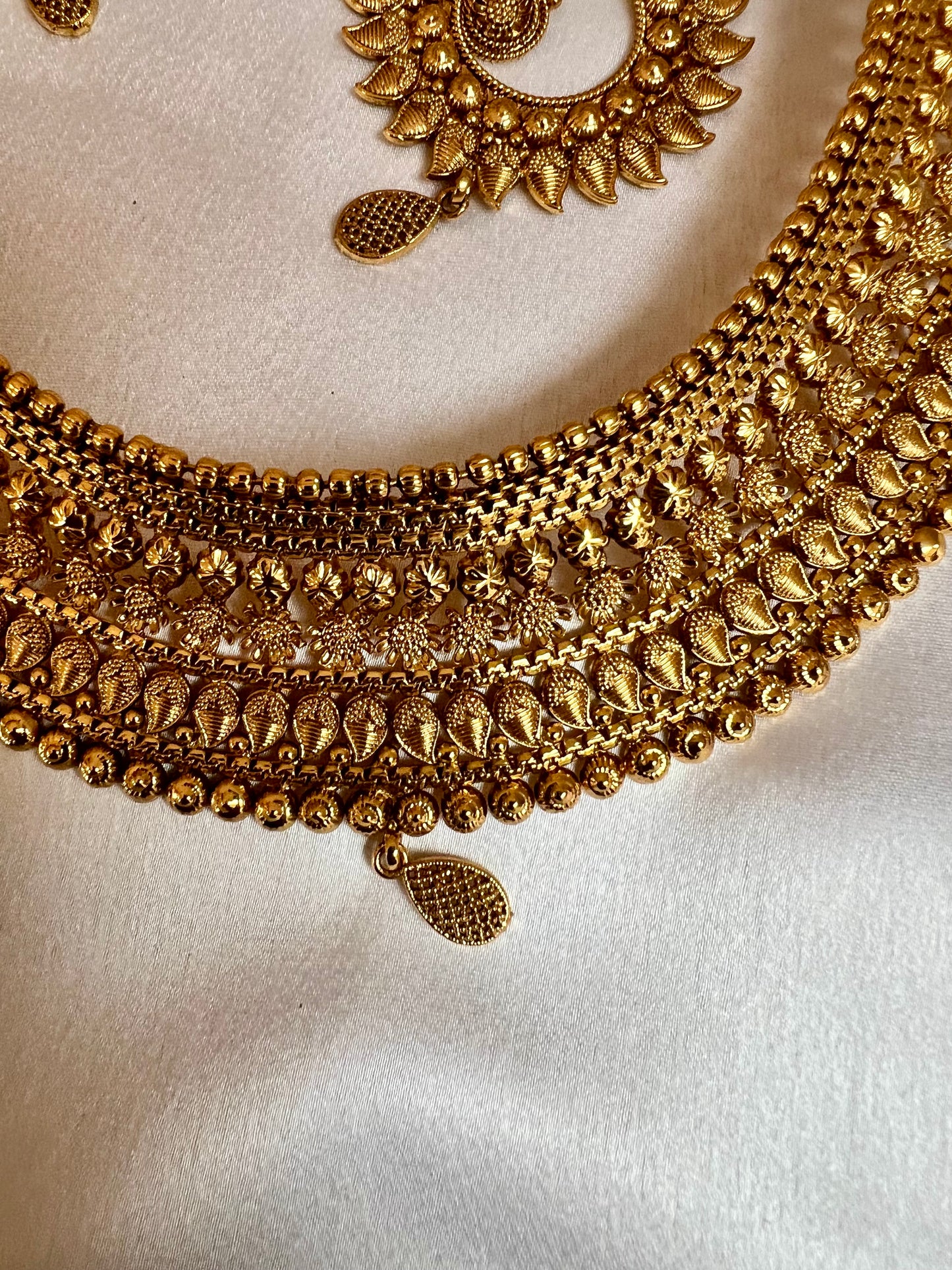 VAISHI - Bridal high neck gold plated necklace with earrings and tikka N3180