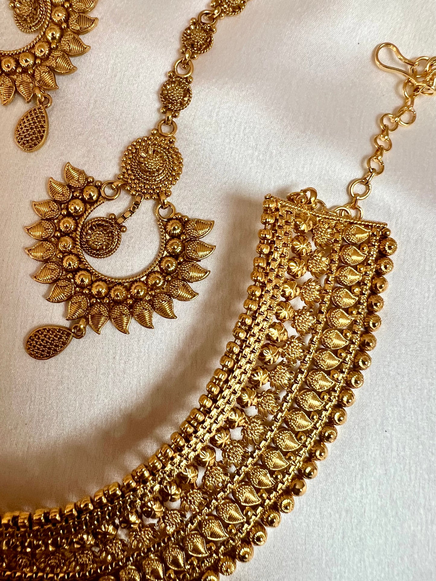 VAISHI - Bridal high neck gold plated necklace with earrings and tikka N3180