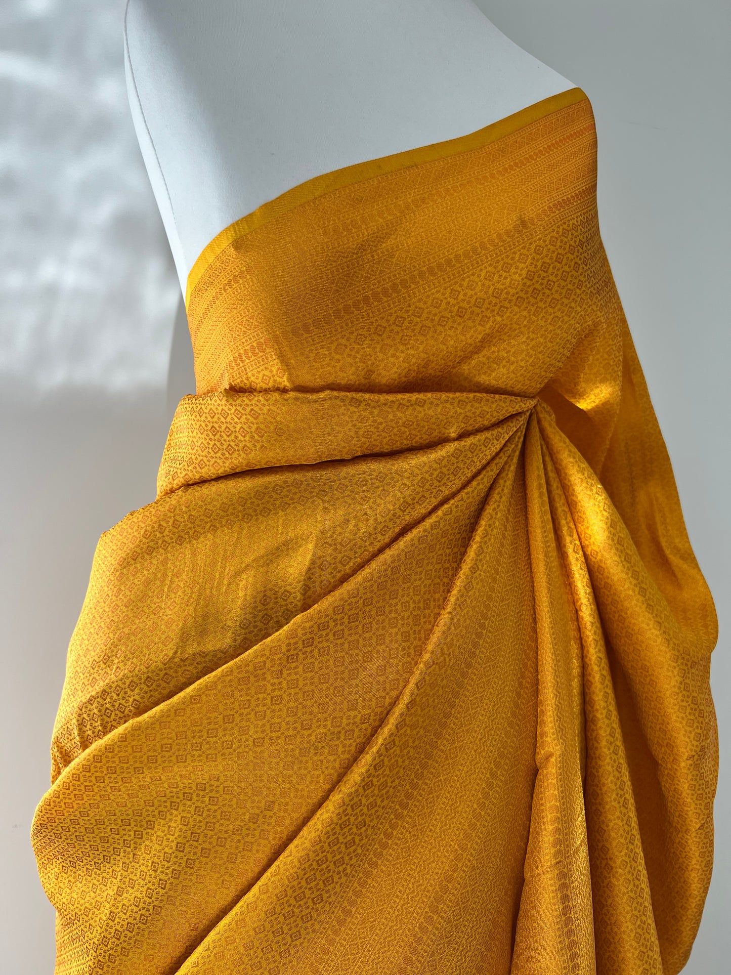 Plain yellow kubera silk saree, comes with tassels and blouse piece attached S3011