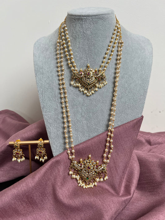 Beautiful short and long pearl necklace with a stunning clear stoned pendant,embellished with rice shaped pearls