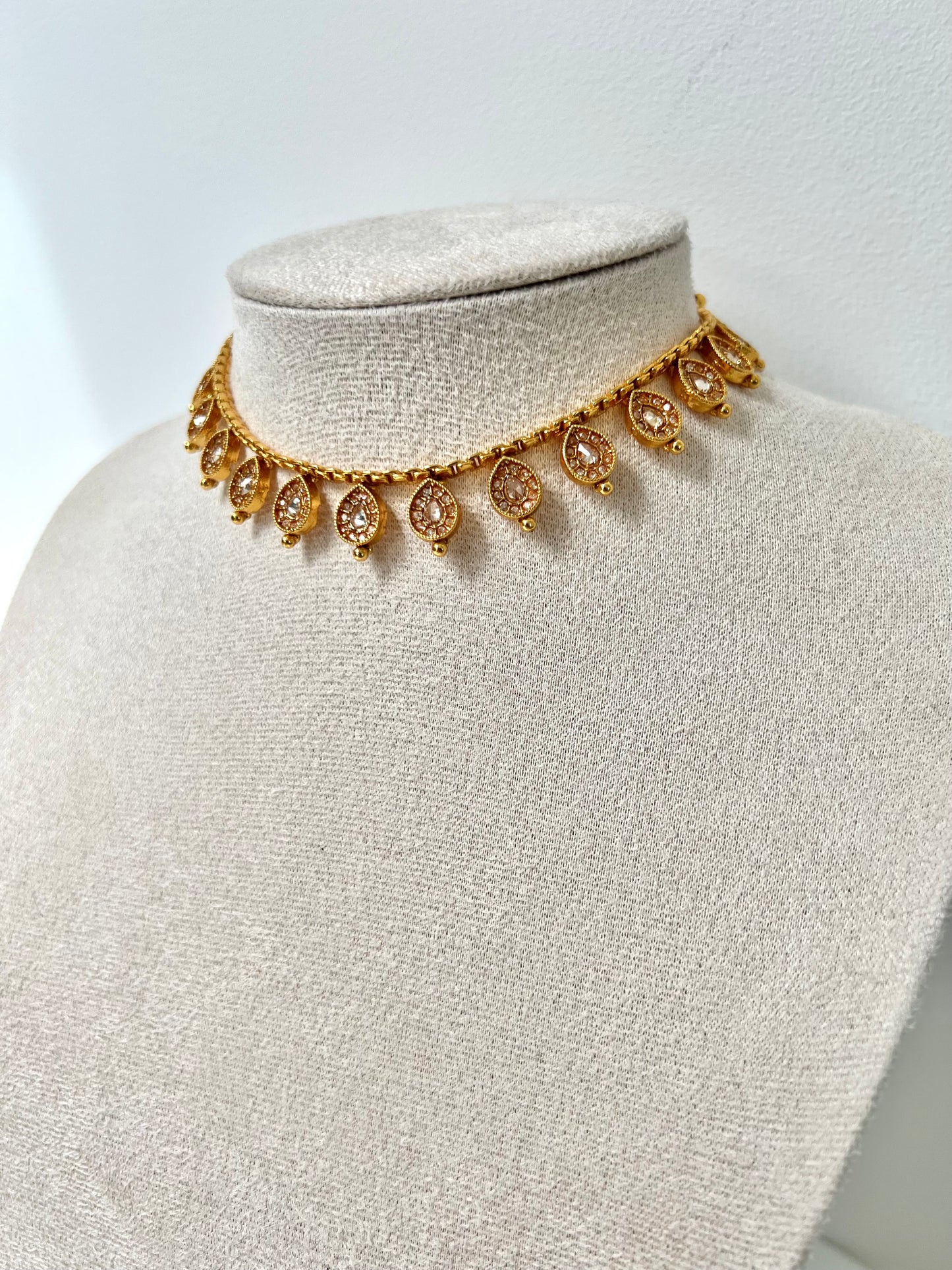 VIMSHA- Dainty simple golden necklace embellished with champagne stones and paired with flat earrings N3254
