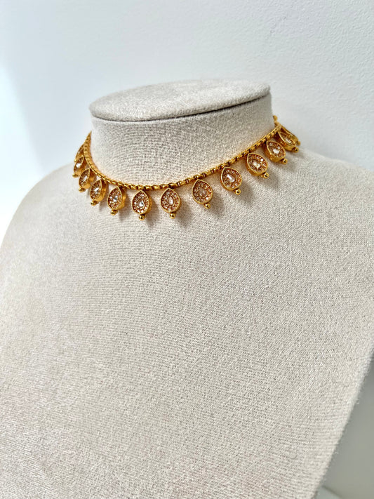 VIMSHA- Dainty simple golden necklace embellished with champagne stones and paired with flat earrings N3254