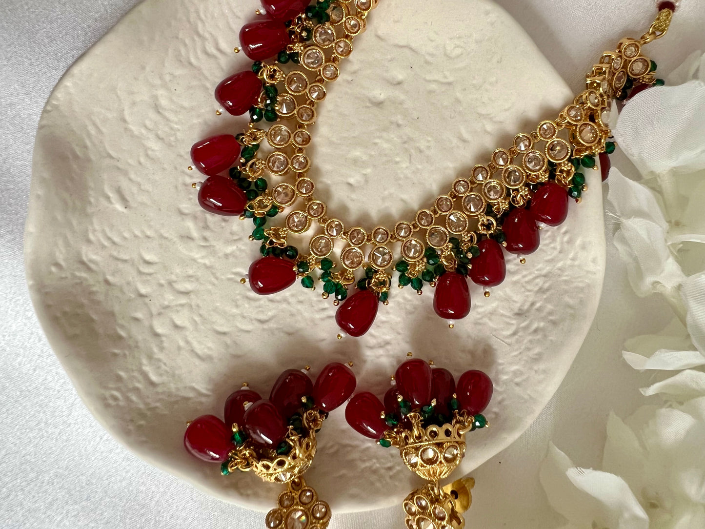 RUBIGA- Short golden necklace with small green and large maroon beads with matching jhumkas N3045