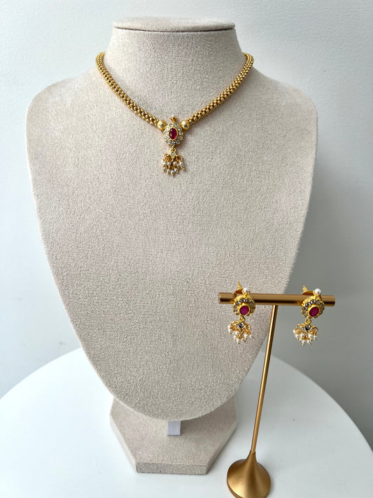 KESHANA - Simple gold chain with a white and ruby stoned centre piece with matching small earrings N3369