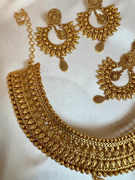 VAISHI - Bridal high neck gold plated necklace with earrings and tikka N3180