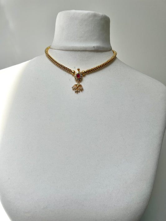 KESHANA - Simple gold chain with a white and ruby stoned centre piece with matching small earrings N3369