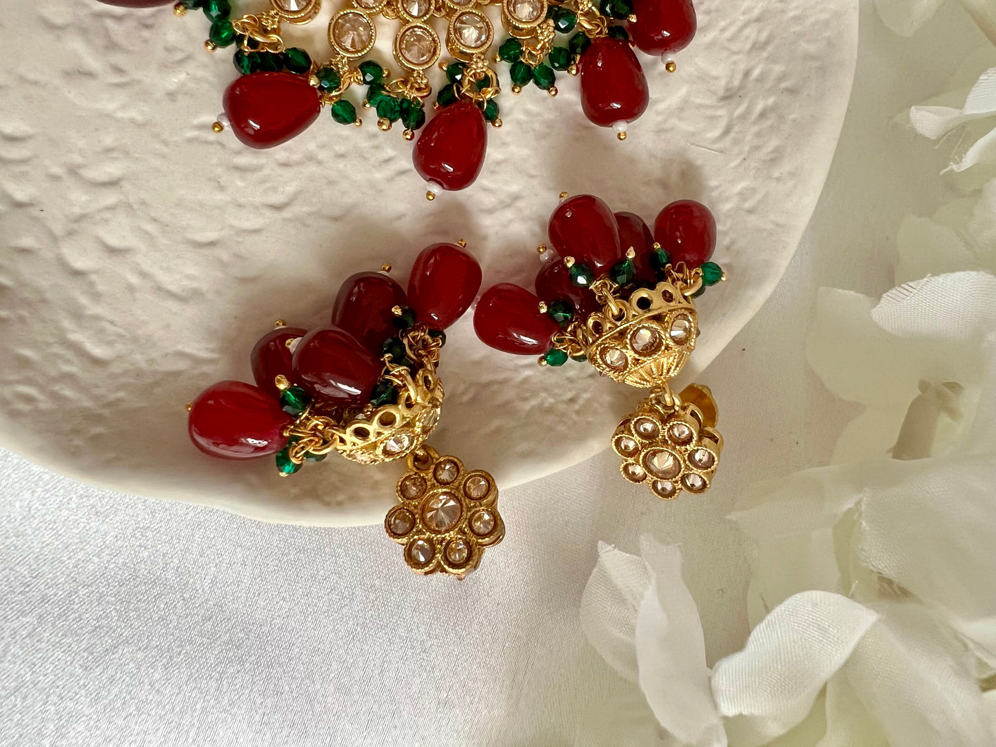 RUBIGA- Short golden necklace with small green and large maroon beads with matching jhumkas N3045