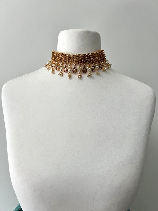 MALANI- Golden high neck band necklace embellished with dangling pearls, comes with matching small jhumkas N3296