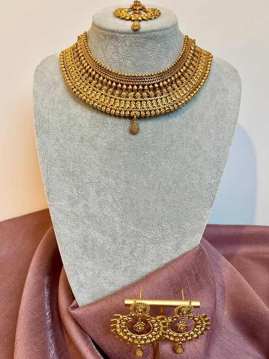 VAISHI - Bridal high neck gold plated necklace with earrings and tikka N3180