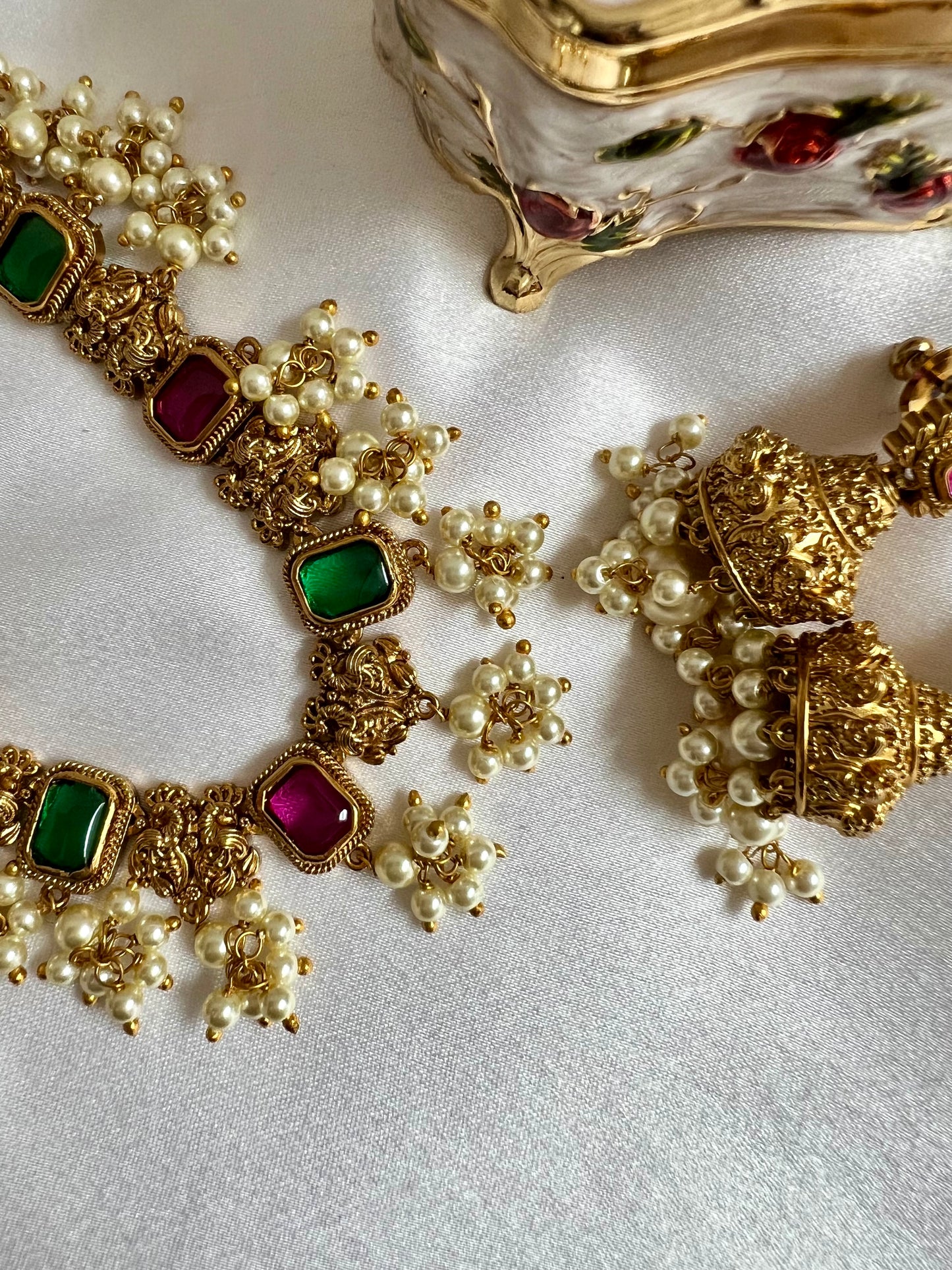 TASHA - Gold plated short necklace with rubygreen stones and dangling ivory pearls, matching jhumkas included N3046