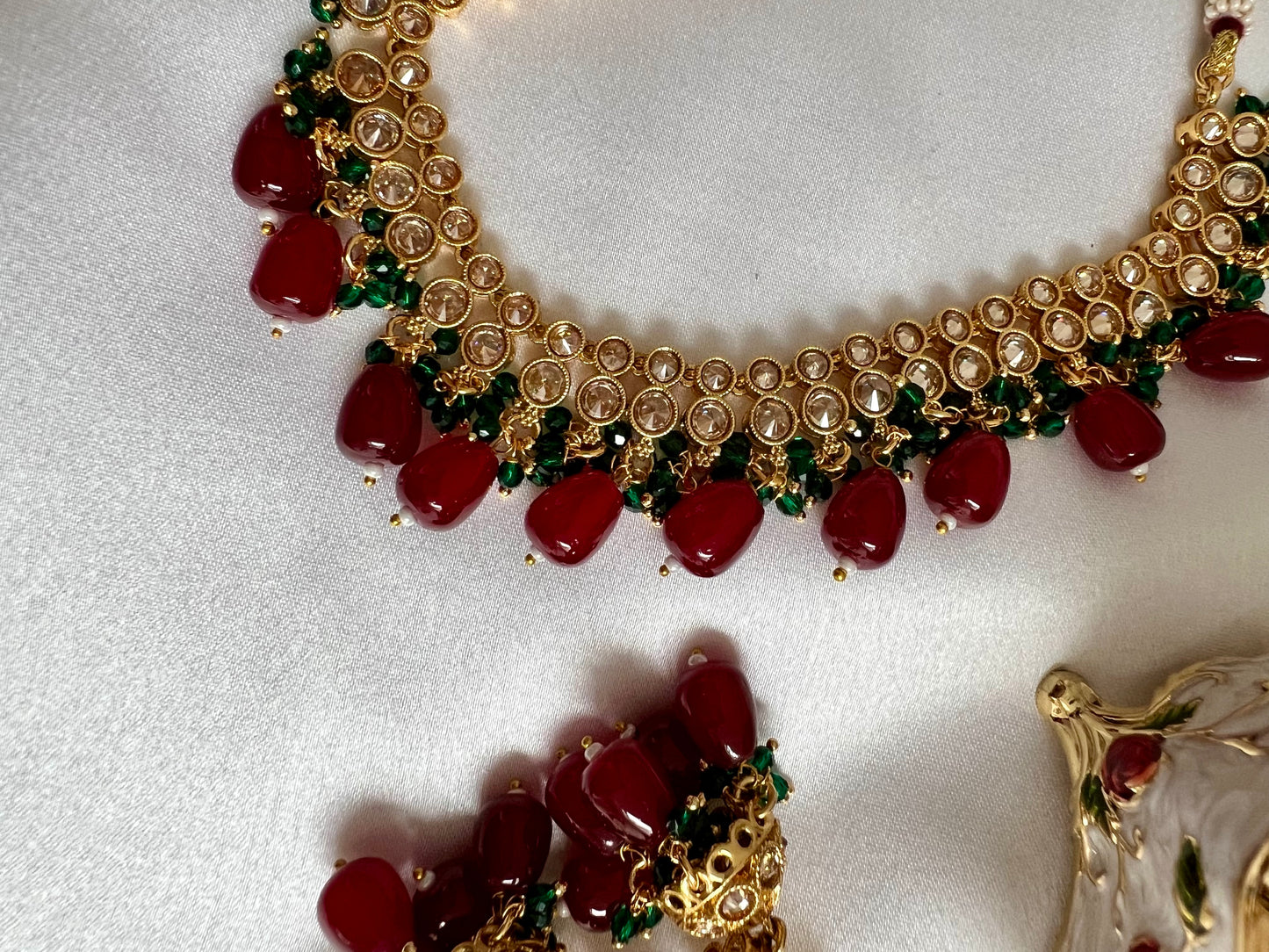 RUBIGA- Short golden necklace with small green and large maroon beads with matching jhumkas N3045