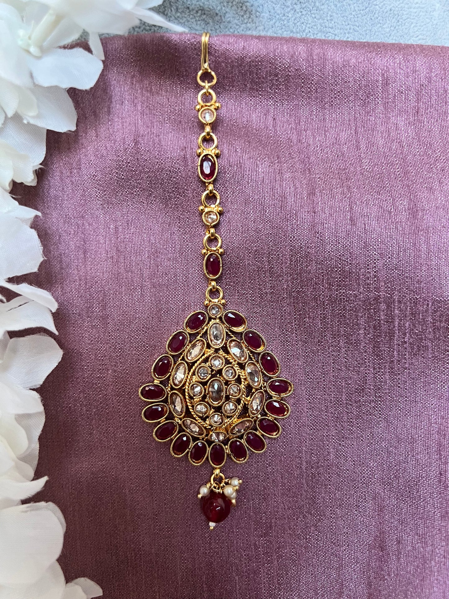Antique gold plated ruby and clear stoned tikka T3011