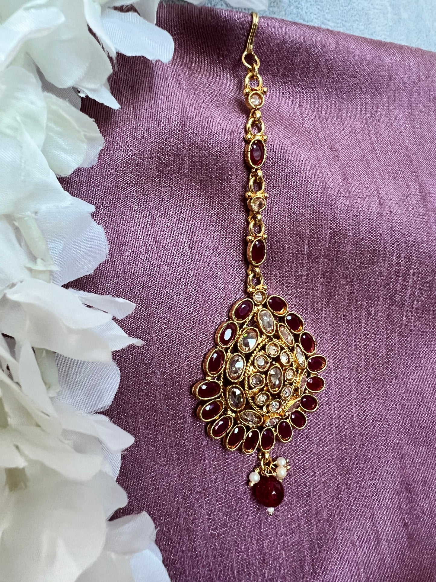 Antique gold plated ruby and clear stoned tikka T3011