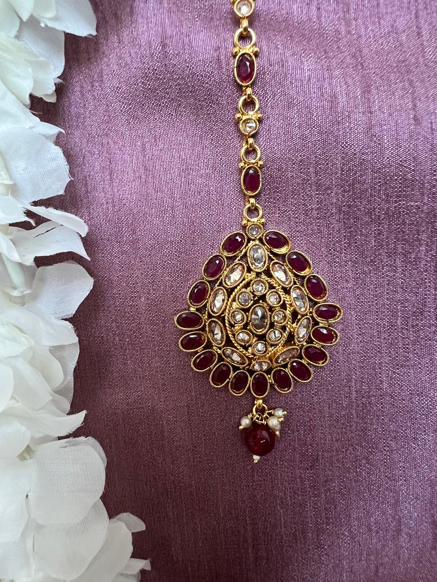 Antique gold plated ruby and clear stoned tikka T3011