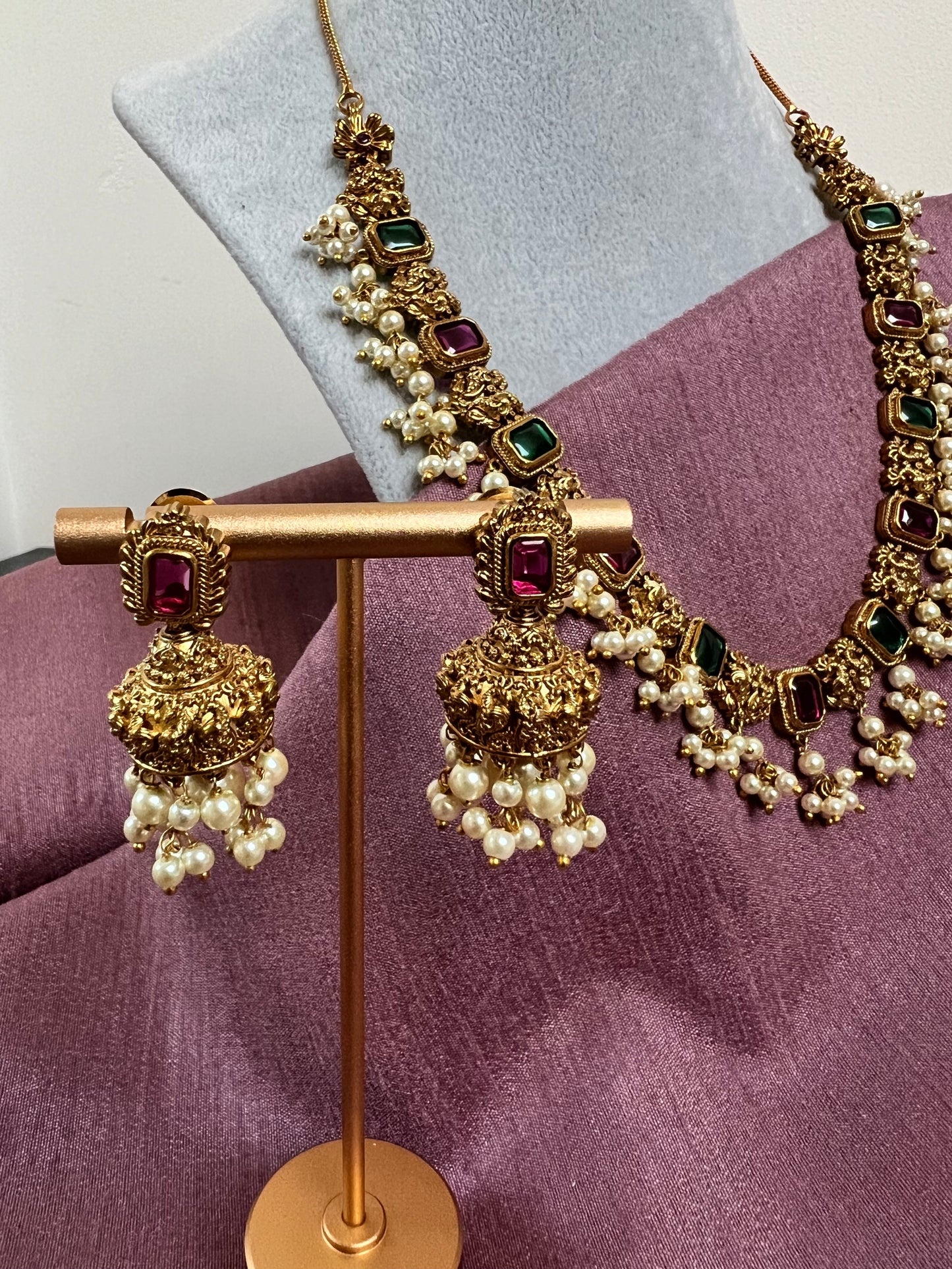 Gold plated short necklace with rubygreen stones and dangling ivory pearls with jhumka N3046