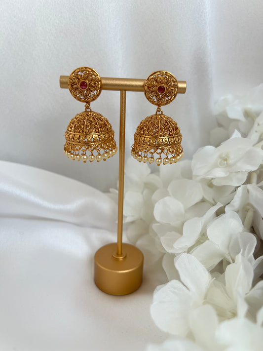 Gold plated jhumka earrings with pearls and ruby stone E3022