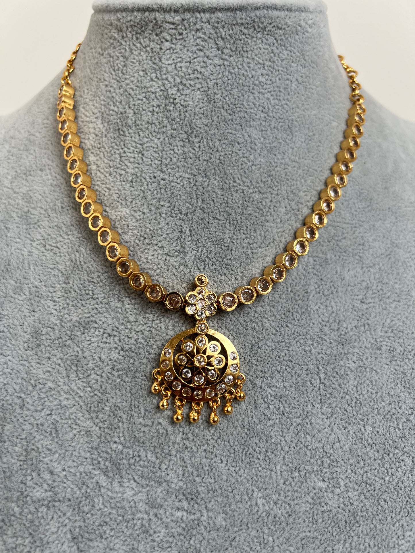 Short golden attigai with white stones N3158