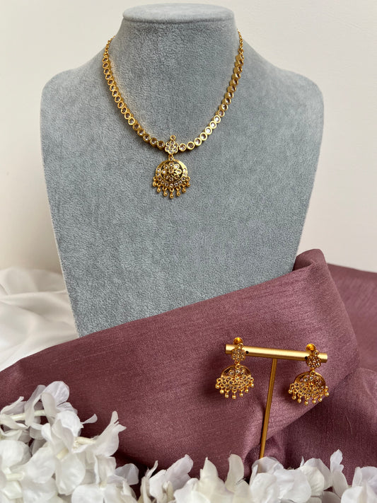 Short golden attigai with white stones and matching earrings N3157